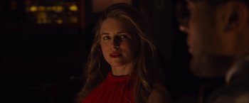 Movie still from “I Origins” (2014), directed by Mike Cahill – A woman in a red top is looking at the camera; Close Up shot, Over the shoulder angle