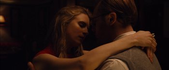 Movie still from “I Origins” (2014), directed by Mike Cahill – A man and a woman embracing each other in the dark; Close Up shot, Overhead angle