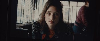 Movie still from “I Origins” (2014), directed by Mike Cahill – A woman with a leather jacket and a sweater on; Close Up shot, Low angle