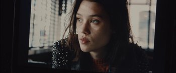 Movie still from “I Origins” (2014), directed by Mike Cahill – A person wearing a leather jacket; Close Up shot, Low angle