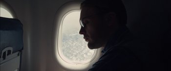 Movie still from “I Origins” (2014), directed by Mike Cahill – A person looking out of an airplane window; Close Up shot, Low angle