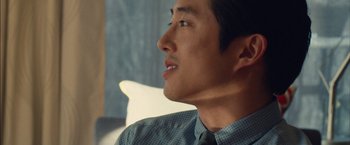 Movie still from “I Origins” (2014), directed by Mike Cahill – A person wearing a shirt and a tie; Close Up shot, Over the shoulder angle