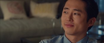 Movie still from “I Origins” (2014), directed by Mike Cahill – A person wearing a blue shirt; Close Up shot, Over the shoulder angle