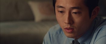 Movie still from “I Origins” (2014), directed by Mike Cahill – A person wearing a shirt and a tie; Close Up shot, Over the shoulder angle