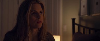 Movie still from “I Origins” (2014), directed by Mike Cahill – A beautiful young woman with long blonde hair and blue eyes; Close Up shot, Over the shoulder angle