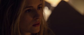 Movie still from “I Origins” (2014), directed by Mike Cahill – A woman's face in the dark; Close Up shot, Over the shoulder angle