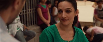 Movie still from “I Origins” (2014), directed by Mike Cahill – A person wearing a green shirt; Close Up shot, Over the shoulder angle