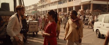 Movie still from “I Origins” (2014), directed by Mike Cahill – A group of people walking down a street; Wide shot, Over the shoulder angle