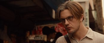 Movie still from “I Origins” (2014), directed by Mike Cahill – A person wearing glasses; Close Up shot, Over the shoulder angle
