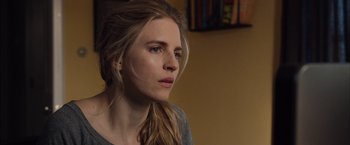 Movie still from “I Origins” (2014), directed by Mike Cahill – A beautiful young woman with long blonde hair and blue eyes; Close Up shot, Over the shoulder angle