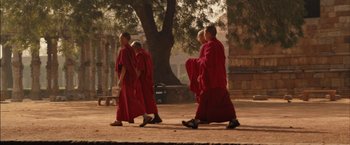 Movie still from “I Origins” (2014), directed by Mike Cahill – A group of monks walking down the street; Wide shot, Low angle