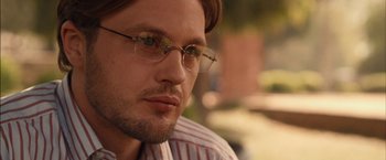 Movie still from “I Origins” (2014), directed by Mike Cahill – A person wearing glasses; Close Up shot, Over the shoulder angle