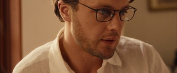 Movie still from “I Origins” (2014), directed by Mike Cahill – A person wearing glasses; Close Up shot, Low angle