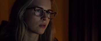 Movie still from “I Origins” (2014), directed by Mike Cahill – A person wearing glasses and looking to the side; Close Up shot, Over the shoulder angle