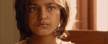 A young girl's face with blue eyes