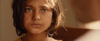 Movie still from “I Origins” (2014), directed by Mike Cahill – A young girl's face; Extreme Close Up shot, High angle