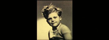 Movie still from “I Stand Alone” (1998), directed by Gaspar Noé – An old black and white photo of a young boy; Extreme Close Up shot, High angle