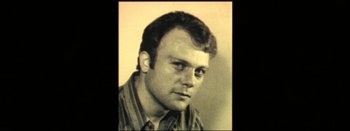 Movie still from “I Stand Alone” (1998), directed by Gaspar Noé – An old photo of a man with a beard; Close Up shot, High angle