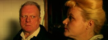 Movie still from “I Stand Alone” (1998), directed by Gaspar Noé – A man and a woman are looking at each other; Close Up shot, High angle