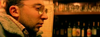 Movie still from “I Stand Alone” (1998), directed by Gaspar Noé – A person wearing a pair of glasses; Close Up shot, Low angle