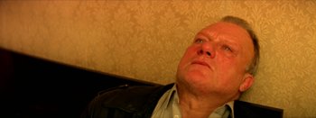 Movie still from “I Stand Alone” (1998), directed by Gaspar Noé – An older man looking up into the ceiling; Close Up shot, Low angle