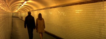 Movie still from “I Stand Alone” (1998), directed by Gaspar Noé – Two people are walking down a subway tunnel; Wide shot, High angle