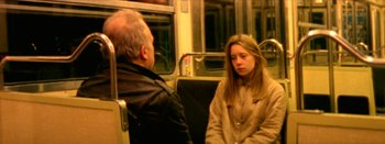 Movie still from “I Stand Alone” (1998), directed by Gaspar Noé – A man and a woman sitting on a bus; Medium shot, High angle