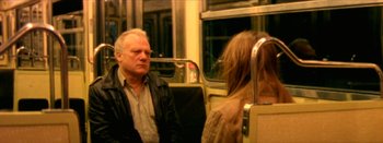Movie still from “I Stand Alone” (1998), directed by Gaspar Noé – A man and a woman on a bus; Medium shot, High angle