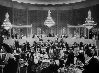 Movie still from “I Wake Up Screaming” (1941), directed by H. Bruce Humberstone – A black - and - white photo of people sitting at tables; Extreme Wide shot, High angle