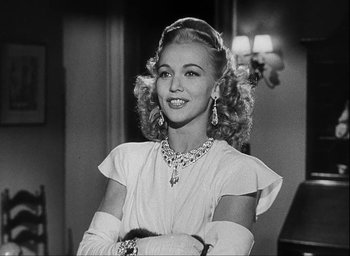 Movie still from “I Wake Up Screaming” (1941), directed by H. Bruce Humberstone – A black - and - white photo of a woman in a white dress; Close Up shot, Low angle