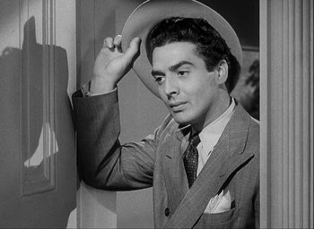 Movie still from “I Wake Up Screaming” (1941), directed by H. Bruce Humberstone – A black and white photo of a man wearing a hat; Close Up shot, Low angle