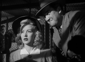 Movie still from “I Wake Up Screaming” (1941), directed by H. Bruce Humberstone – A man and a woman are standing next to each other; Medium shot, Low angle