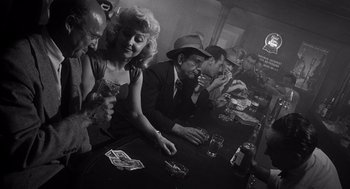 Movie still from “I Want to Live!” (1958), directed by Robert Wise – A group of people sitting at a bar drinking and smoking; Medium shot, High angle