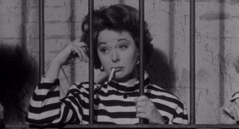 Movie still from “I Want to Live!” (1958), directed by Robert Wise – An old photo of a woman in a jail cell; Medium shot, Overhead angle