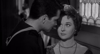 Movie still from “I Want to Live!” (1958), directed by Robert Wise – A man and a woman looking at one another; Close Up shot, Over the shoulder angle