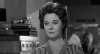 Movie still from “I Want to Live!” (1958), directed by Robert Wise – A black - and - white photo of a woman in a striped shirt; Close Up shot, Over the shoulder angle