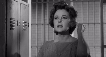 Movie still from “I Want to Live!” (1958), directed by Robert Wise – An old black and white photo of a woman in front of a jail cell; Close Up shot, Low angle