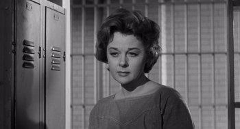 Movie still from “I Want to Live!” (1958), directed by Robert Wise – A black - and - white photo of a woman in front of a jail cell; Close Up shot, Low angle