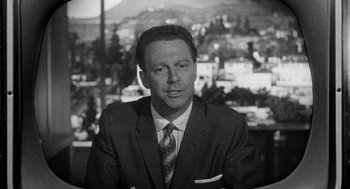 Movie still from “I Want to Live!” (1958), directed by Robert Wise – An old photo of a man in a suit; Close Up shot, High angle