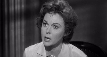 Movie still from “I Want to Live!” (1958), directed by Robert Wise – An old photo of an older woman looking at the camera; Close Up shot, High angle