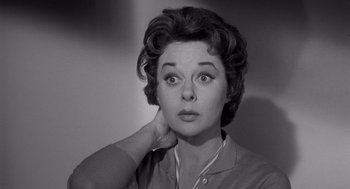 Movie still from “I Want to Live!” (1958), directed by Robert Wise – An old photo of an older woman looking surprised; Close Up shot, Low angle
