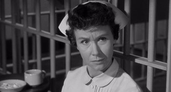 Movie still from “I Want to Live!” (1958), directed by Robert Wise – An old photo of a woman wearing a nurse's uniform; Close Up shot, High angle