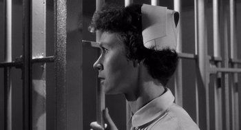 Movie still from “I Want to Live!” (1958), directed by Robert Wise – A woman wearing a bandage on her head; Close Up shot, Low angle