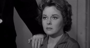 Movie still from “I Want to Live!” (1958), directed by Robert Wise – An old photo of an older woman with a hand on her shoulder; Close Up shot, Over the shoulder angle