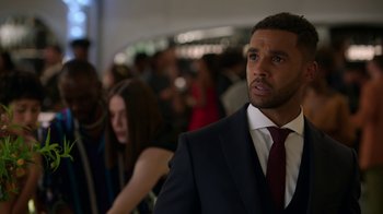 Movie still from “Emily in Paris” (2020), created by Darren Star – A man in a suit and a tie; Close Up shot, Over the shoulder angle