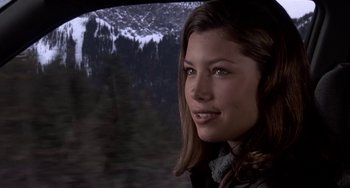 Movie still from “I'll Be Home for Christmas” (1998), directed by Arlene Sanford – A beautiful young woman looking out of a car window; Close Up shot, Over the shoulder angle