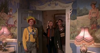 Movie still from “I'll Be Home for Christmas” (1998), directed by Arlene Sanford – A group of people standing next to each other in a room; Medium shot, High angle
