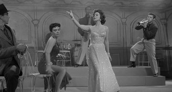 Movie still from “I'll Cry Tomorrow” (1955), directed by Daniel Mann – Two women are performing on a stage; Medium shot, Low angle