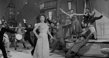 Movie still from “I'll Cry Tomorrow” (1955), directed by Daniel Mann – A black and white photo of a group of people dancing; Wide shot, Low angle