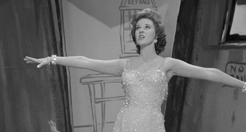 Movie still from “I'll Cry Tomorrow” (1955), directed by Daniel Mann – Black and white photograph of a woman in a dress; Medium shot, Low angle